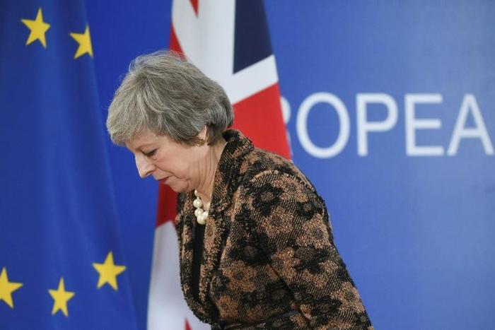 British Prime Minister Theresa May is struggling to find ways to get MPs to back her unpopular divorce deal