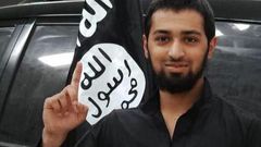 ISIS media posted images of a boy the group called Abu Yousef al Britani, in one picture, the teen known as Talha Asmal back in England raises his index finger