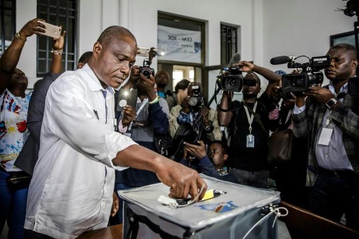 Presidential candidate Martin Fayulu casts his vote at the Insititut de la Gombe polling station in Kinshasa during the DR Congo's general election on December 30, 2018