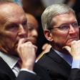 Apple CEO Tim Cook listening to a Barack Obama speech