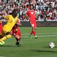 Australia's Awer Mabil scores as the Socceroos beat Palestine to keep their hopes of a last 16 place alive