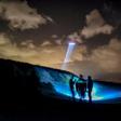French gendarmes patrol while a police helicopter flies over the beach of Oye-Plage, near Calais, northern France, as they try to intercept migrants attempting to cross the Channel