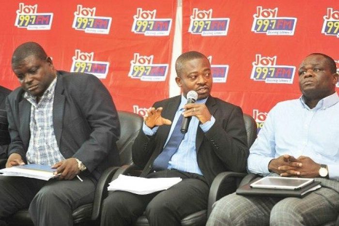 Seth Twum-Akwaboah, (seated middle) Chief Executive Officer (CEO) of AGI