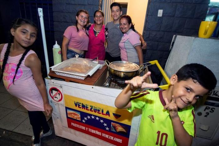 The 11 members of the Villamarin family left Venezuela a month ago and now get by selling Venezuelan street food in Lima, the capital of Peru