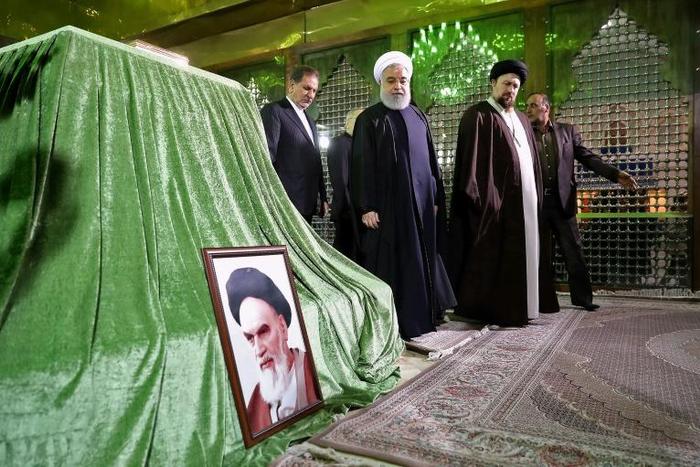 Iran's President Hassan Rouhani (C) visits the mausoleum of the Islamic republic's founder Ayatollah Ruhollah Khomeini in Tehran in a handout picture released by his office on January 30, 2019