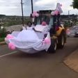 Newly wedded couple uses forklift as wedding car