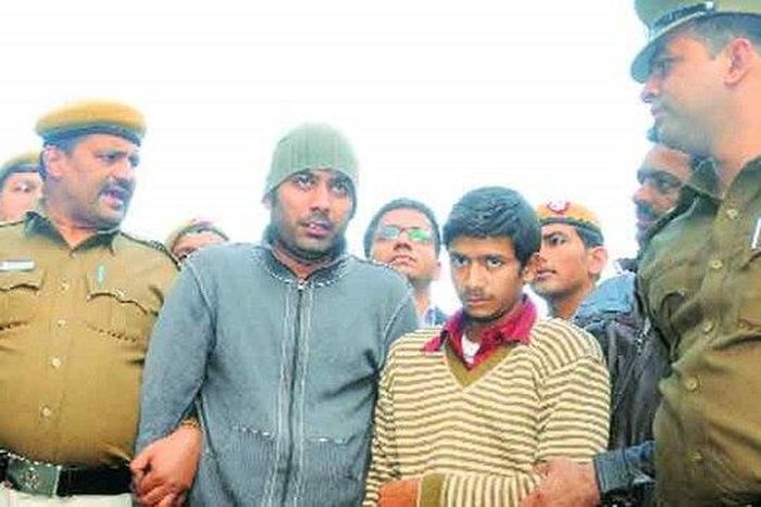 Dr Ashok Yadav being led away by police