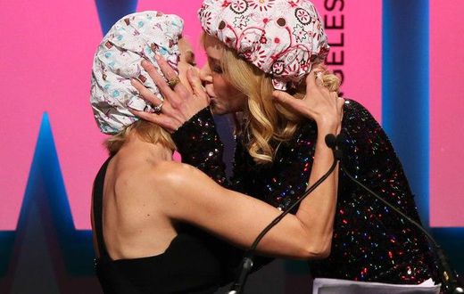 Nicole Kidman and Naomi Watts enjoy a kiss on the stage