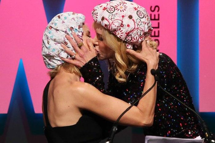 Nicole Kidman and Naomi Watts enjoy a kiss on the stage