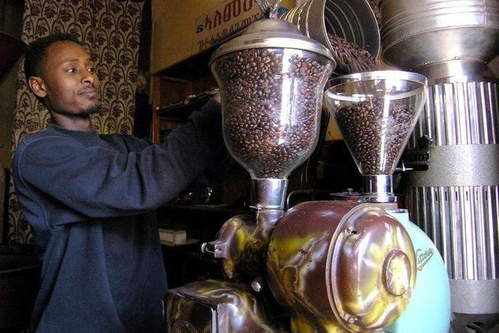 A coffee seller prepares his coffee grinders for action in downtown Asmara in this January 4, 2006 file photo.  REUTERS/Ed Harris