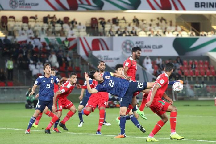 Japan skipper Maya Yoshida in acrobatic action on Sunday against Oman