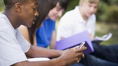 A student Playing with a phone