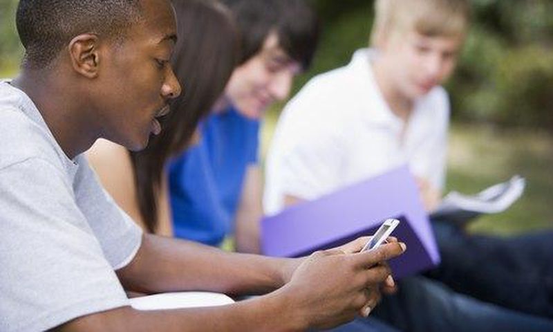 A student Playing with a phone