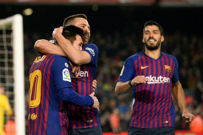 Lionel Messi celebrates with Jordi Alba after scoring on Sunday