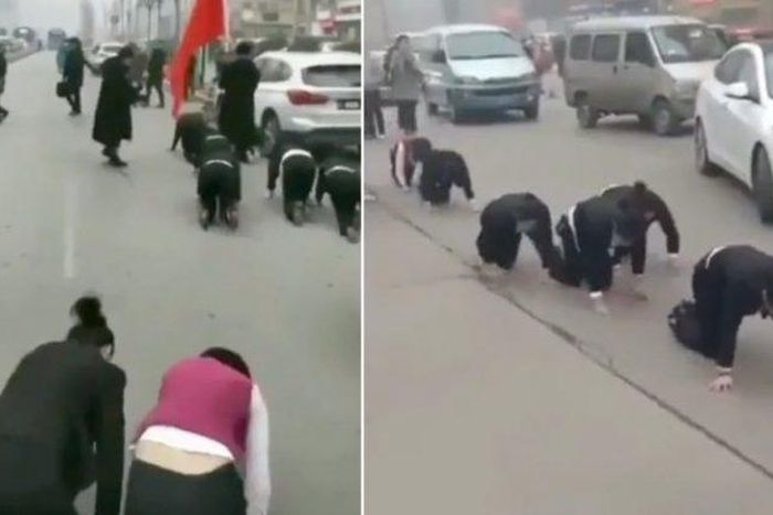 Company makes employees crawl through the streets for failing to meet sales targets (Video)