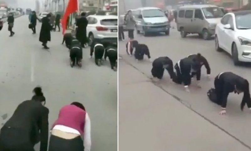 Company makes employees crawl through the streets for failing to meet sales targets (Video)