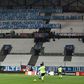 Sending a message: the teams warmed up before an empty south stand at Marseille on Friday