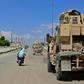 Vehicles of the US-led coalition battling the Islamic State group patrol the town of Rmelane in Syria's Hasakeh province on June 5, 2018
