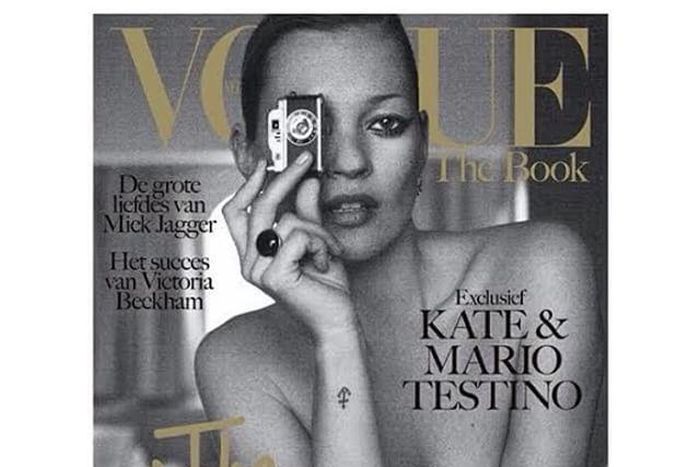 Kate Moss poses topless for Vogue