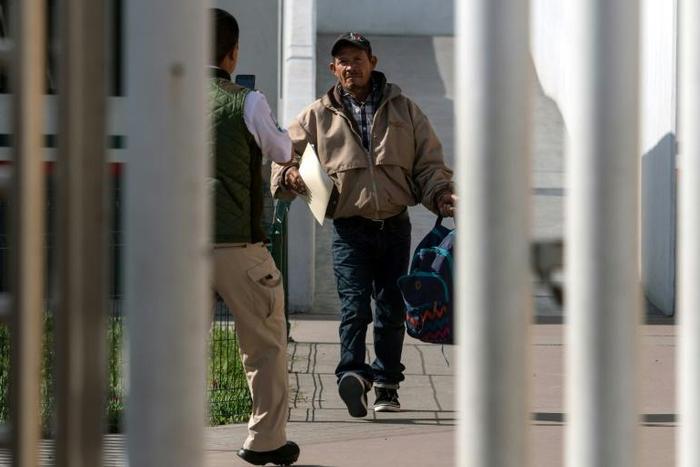Carlos Catarlo Gomez, an asylum seeker from Honduras, returns to Mexico from the United States while his case is processed by US authorities, at El Chaparral crossing port on the US-Mexico border, in Tijuana, Mexico, on January 29, 2019
