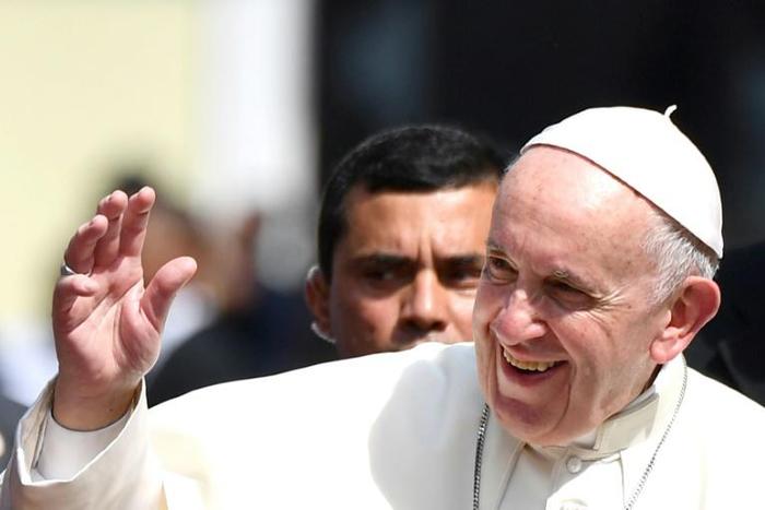 Pope Francis waves after a meeting with Central American bishops in which he blasted "fears and suspicions" over migration