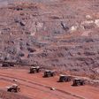 Haul trucks are seen at Kumba Iron Ore, the world's largest iron ore mines in Khathu, Northern Cape Province November 15, 2011. REUTERS/Siphiwe Sibeko