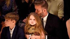 David Beckham kisses her daughter; Harper's hair during the show