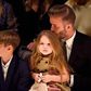 David Beckham kisses her daughter; Harper's hair during the show