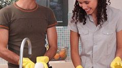 Happy couple doing chores