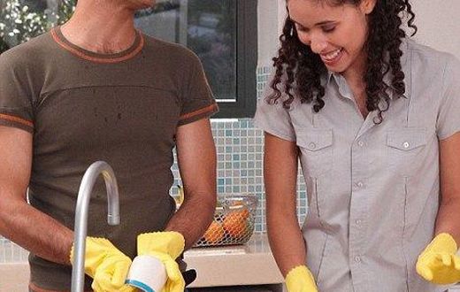 Happy couple doing chores