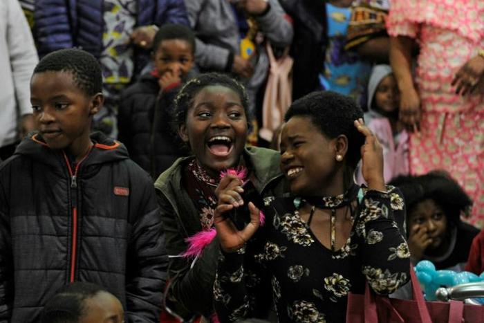 Refugee children sing "Happy Birthday" at the celebration to mark their American birthdays in Kansas city, Missouri