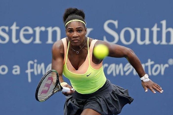 Serena Williams (USA) charges the net to return a shot against Tsventana Pironkova (not pictured) on day five during the Western and Southern Open tennis tournament at Linder Family Tennis Center. Mandatory Credit: Aaron Doster-USA TODAY Sports