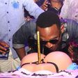 D'Banj savouring his booty on a G-string inspired birthday cake