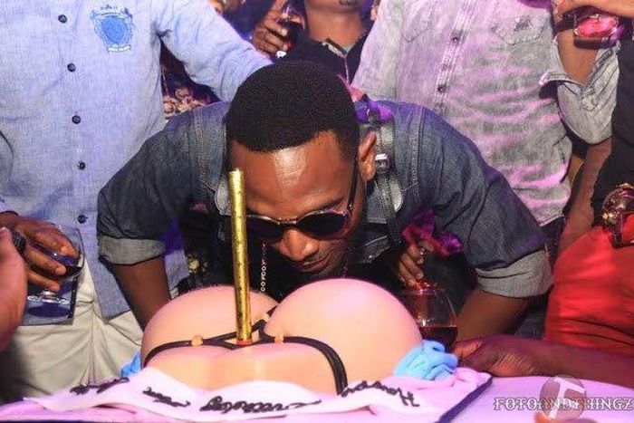 D'Banj savouring his booty on a G-string inspired birthday cake