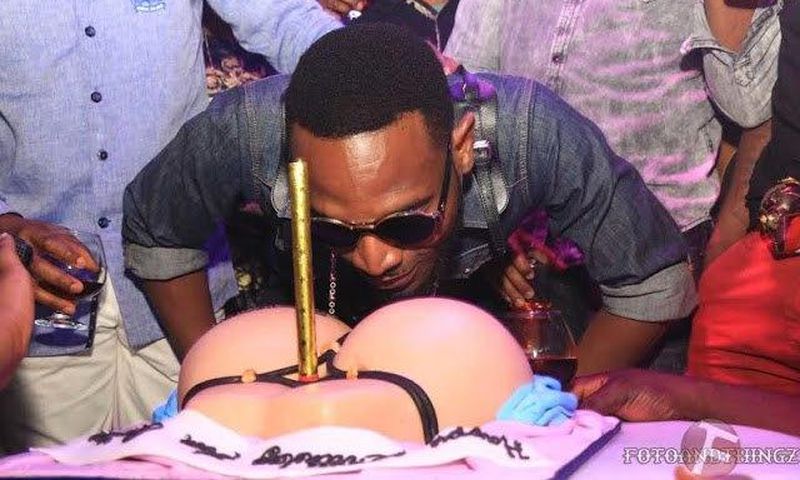 D'Banj savouring his booty on a G-string inspired birthday cake