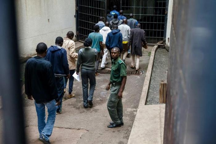 In unprecedented scenes, suspects have been hauled into court by the truckload, then denied bail and immediately put on trial in many cases -- some before they are given access to lawyers