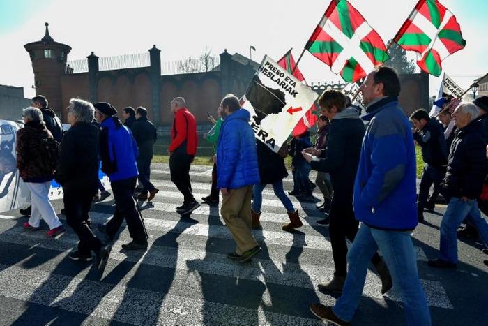 People holding Basque flags demonstrated in December outside Basauri jail near Bilbao for the release of ETA-linked prisoners -- but some relatives of the group's victims strongly oppose detainees being brought closer to home