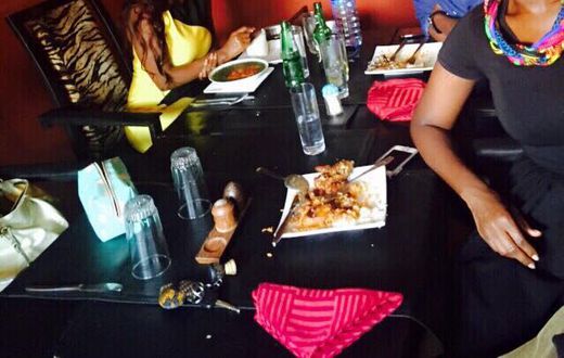 Nana Aba Anamoah in yellow, Benny Blanco and Ama K Abebrese having lunch