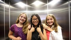 Three winners of the refugee poetry contest pose for pictures at Aki Studio Theatre in Regent Park to mark World Refugee Day.