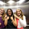 Three winners of the refugee poetry contest pose for pictures at Aki Studio Theatre in Regent Park to mark World Refugee Day.