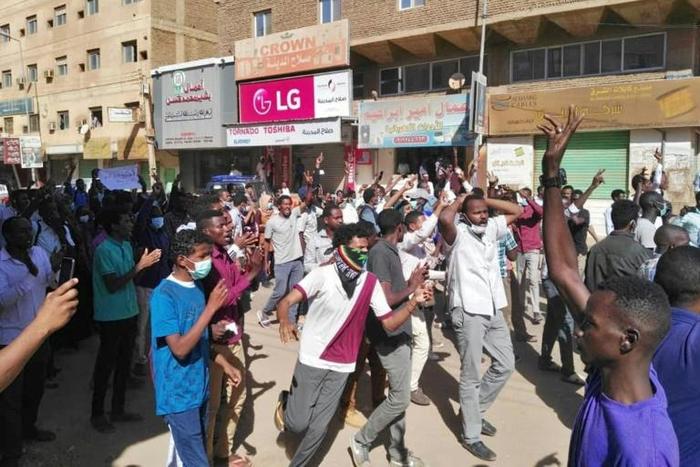 Sudanese protesters chant slogans during an anti-government demonstration in the capital Khartoum on Sunday