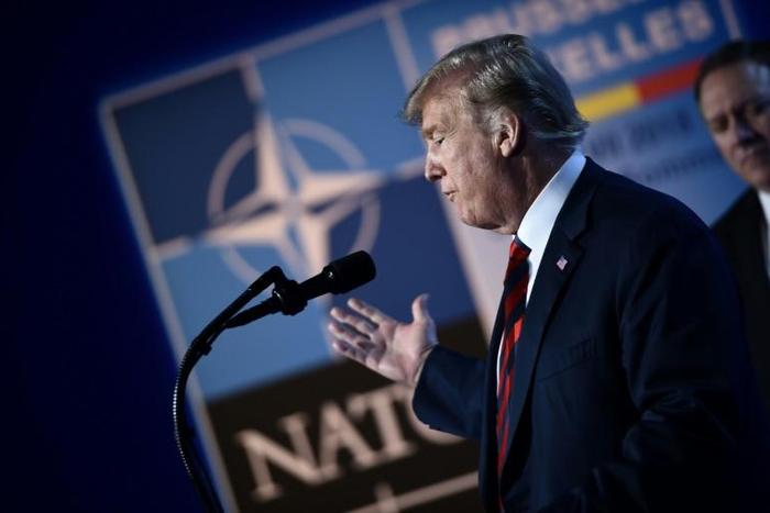 US President Donald Trump gestures at the July 2018 NATO summit in Brussels