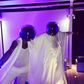David Tlale and D'Banj adorning Daft Punk helmets on white attires