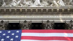 The American flag hangs outside the New York Stock Exchange, July 6, 2015