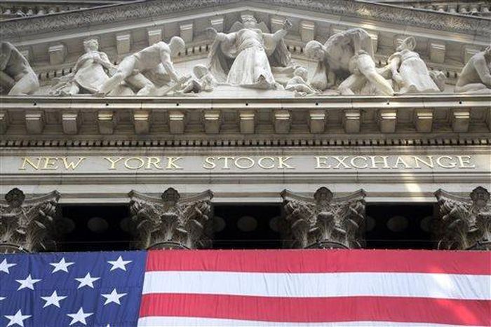 The American flag hangs outside the New York Stock Exchange, July 6, 2015