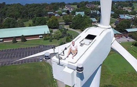 Drone catches man on top of a 200ft wind turbine