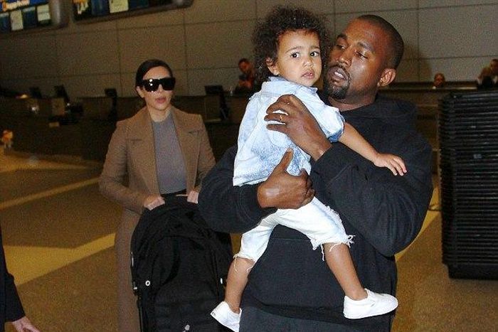 Kanye West arrives LAX with Kim Kardashian and North West
