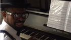Basketmouth playing the piano