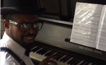 Basketmouth playing the piano