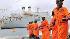 Workers installing the submarine cable.